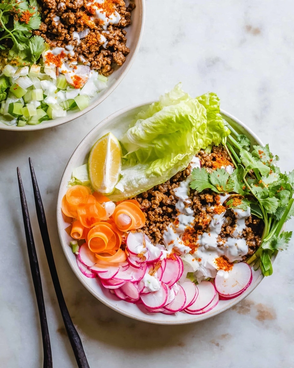 Two white round bowls sit on a white marbled surface, each filled with fresh, colorful ingredients. In the main bowl, the base layer is chopped green iceberg lettuce forming a wedge on one side. Next to the lettuce are small bright orange carrot slices. On the opposite side, cooked ground beef with a crumbly, rich brown texture creates a hearty layer. Thinly sliced red onions and whole radishes with green stems lay nearby, adding pops of pink and white. Fresh green cilantro sprigs top the side along with a lemon wedge pressed against the lettuce. White sauce, drizzled lightly and dusted with a red spice, creates a contrast on the lettuce and beef. A pair of black chopsticks rests alongside the plate. The background bowl shows a similar layout with more lettuce wedge, carrots, and drizzled sauce. photo taken with an iphone --ar 4:5 --v 7