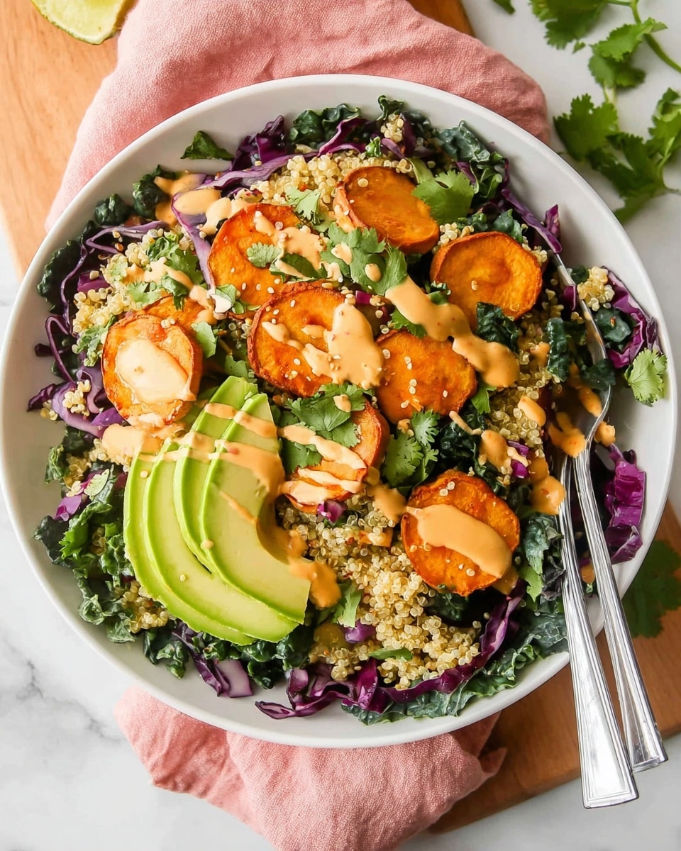 A white bowl filled with a colorful salad placed on a white marbled surface with a wooden board and green leaves around it. The salad has layers starting with a base of shredded purple cabbage and dark leafy greens. On top, there are round, thick slices of roasted orange sweet potatoes, scattered light yellow quinoa, and fresh green cilantro leaves spread all over. Half-moon slices of light green avocado are placed on the edges, and the entire salad is drizzled with a smooth, light orange dressing. Two silver forks rest on the right side inside the bowl, and a pink cloth is partly visible underneath. Photo taken with an iphone --ar 4:5 --v 7
