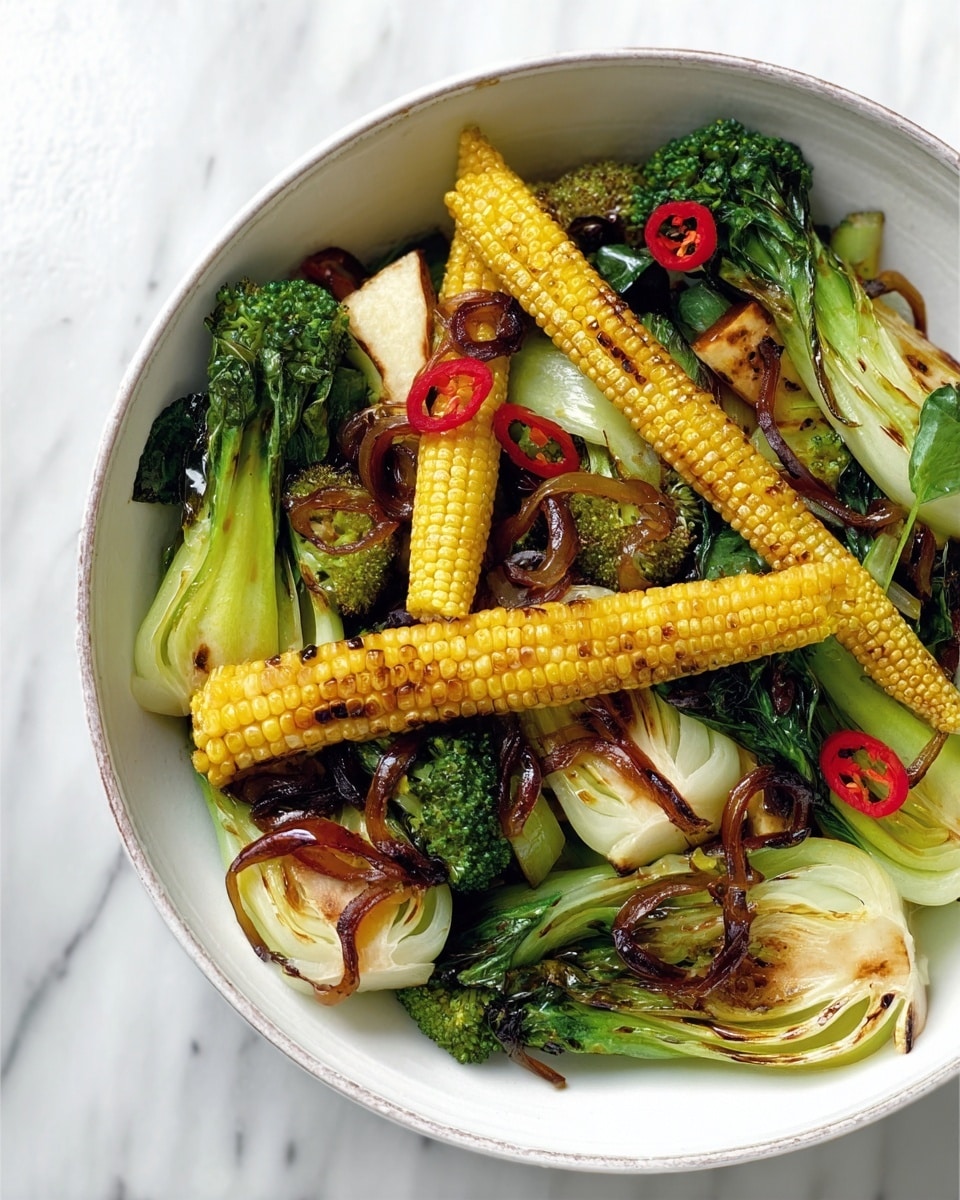 A white bowl filled with a colorful mix of grilled vegetables, arranged in layers. The bottom layer shows large green pieces of broccoli with a rough texture and pale green bok choy slices that are slightly charred, giving a mix of smooth and textured surfaces. On top of these, there are long, bright yellow baby corn cobs placed diagonally, adding a linear pattern. Scattered among them are thin, round slices of red chili and caramelized brown onion rings, adding pops of red and glossy brown. The dish sits on a white marbled surface. photo taken with an iphone --ar 4:5 --v 7